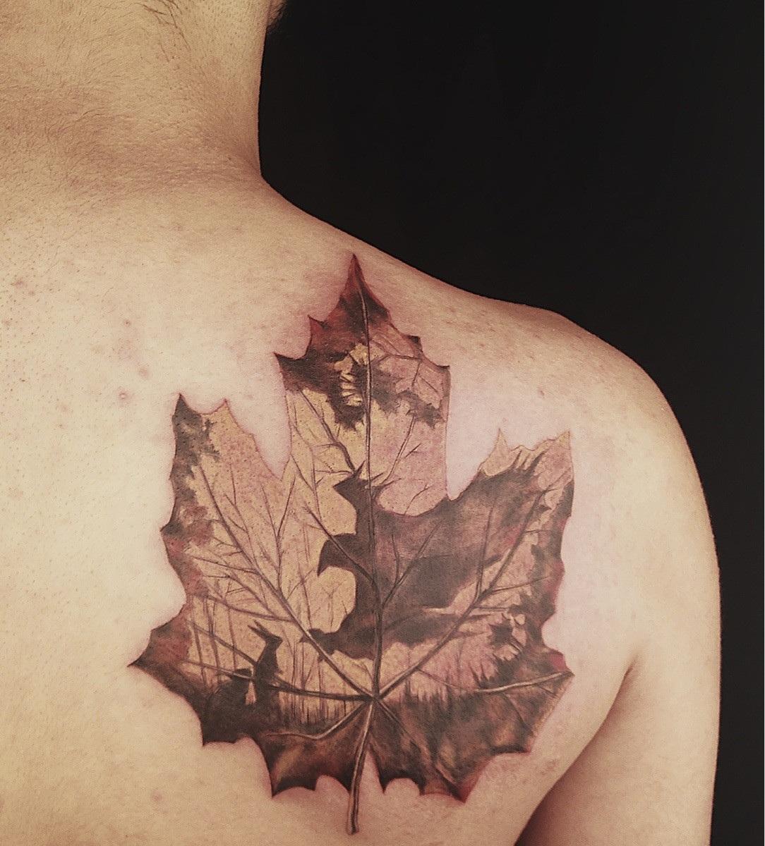 Maple Leaf Tattoo On Right Back Shoulder