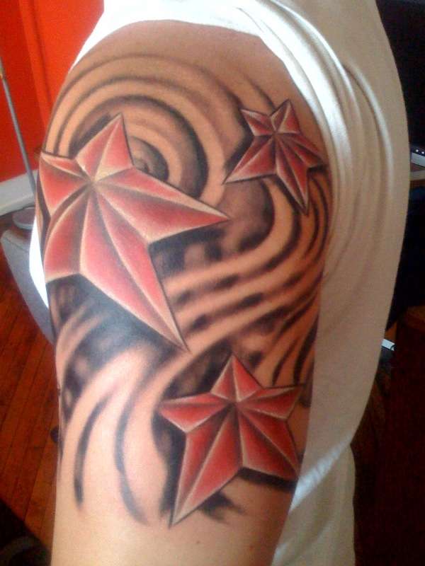 Red Nautical Star Tattoo On Half Sleeve