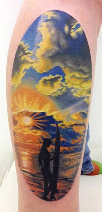 Rising Sun On Beach Tattoo On Leg by Jennifer Sterry