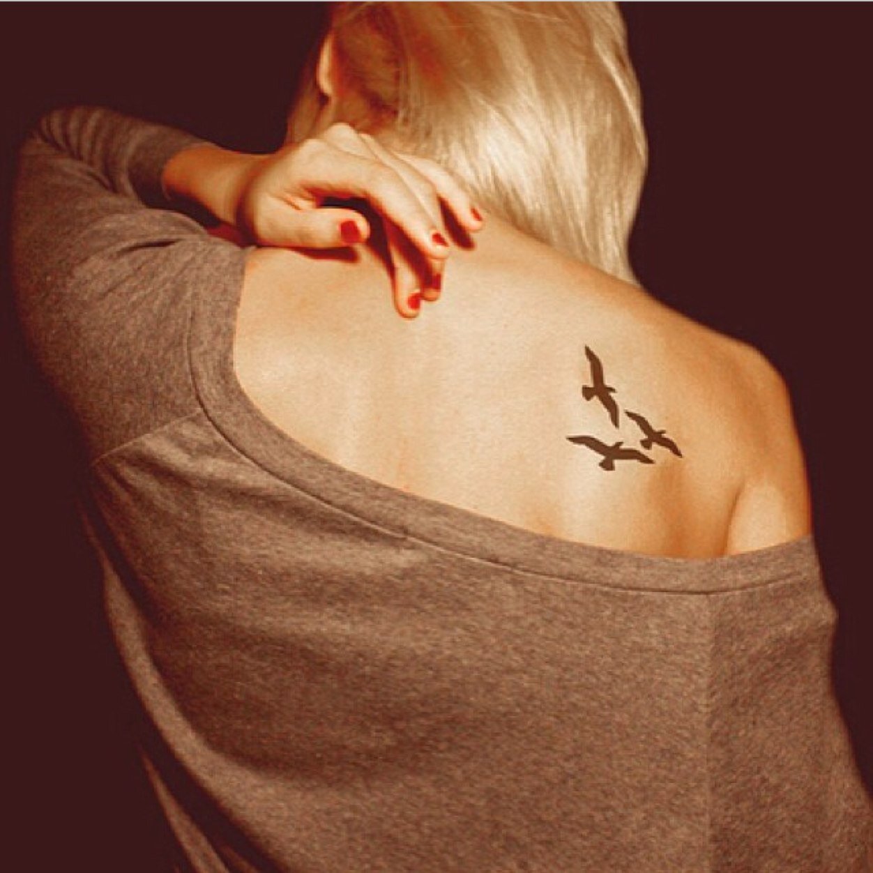 Three Black Little Bird Tattoo On Girl Back Shoulder