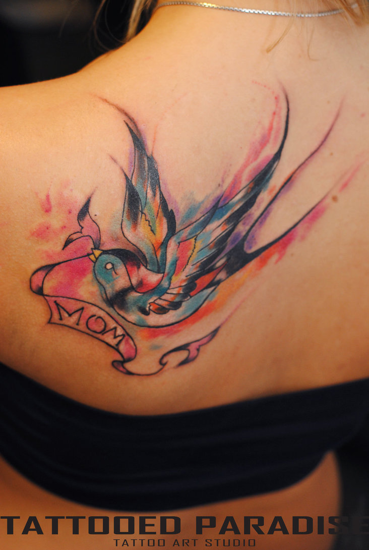 Watercolor Banner In Swallow Beak Tattoo on Girl Back Shoulder By Aleksandra Katsan