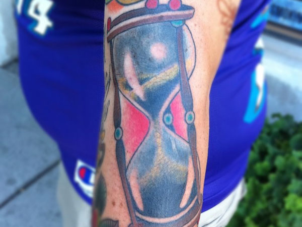 Watercolor Hourglass Tattoo On Left Arm