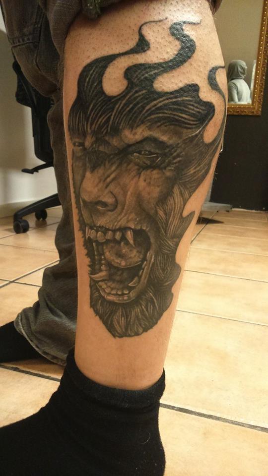 Read Complete Werewolf Head Tattoo on Leg