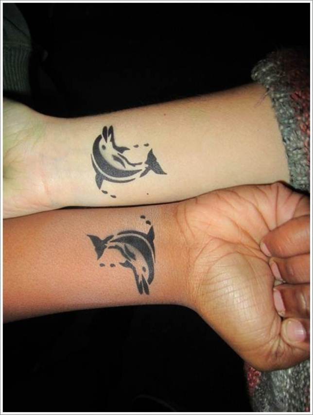 Amazing Black Dolphin Tattoo On Couple Wrist