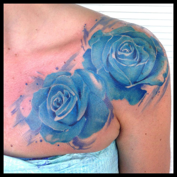 Awesome Two Blue Rose Tattoo On Girl Right Front Shoulder