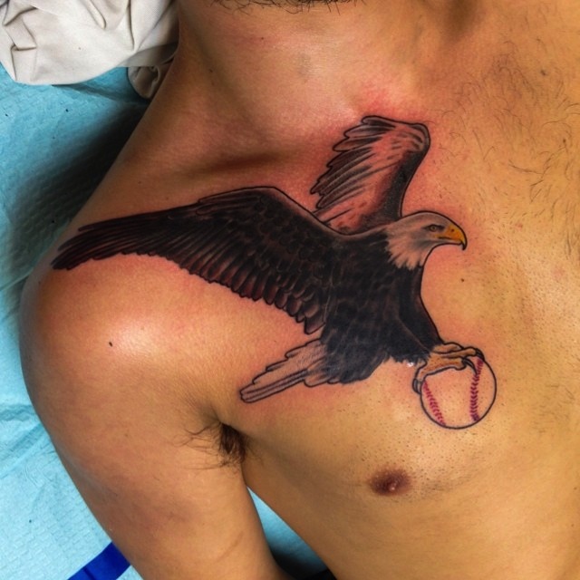 Baseball In Eagle Claws Tattoo On Man Chest
