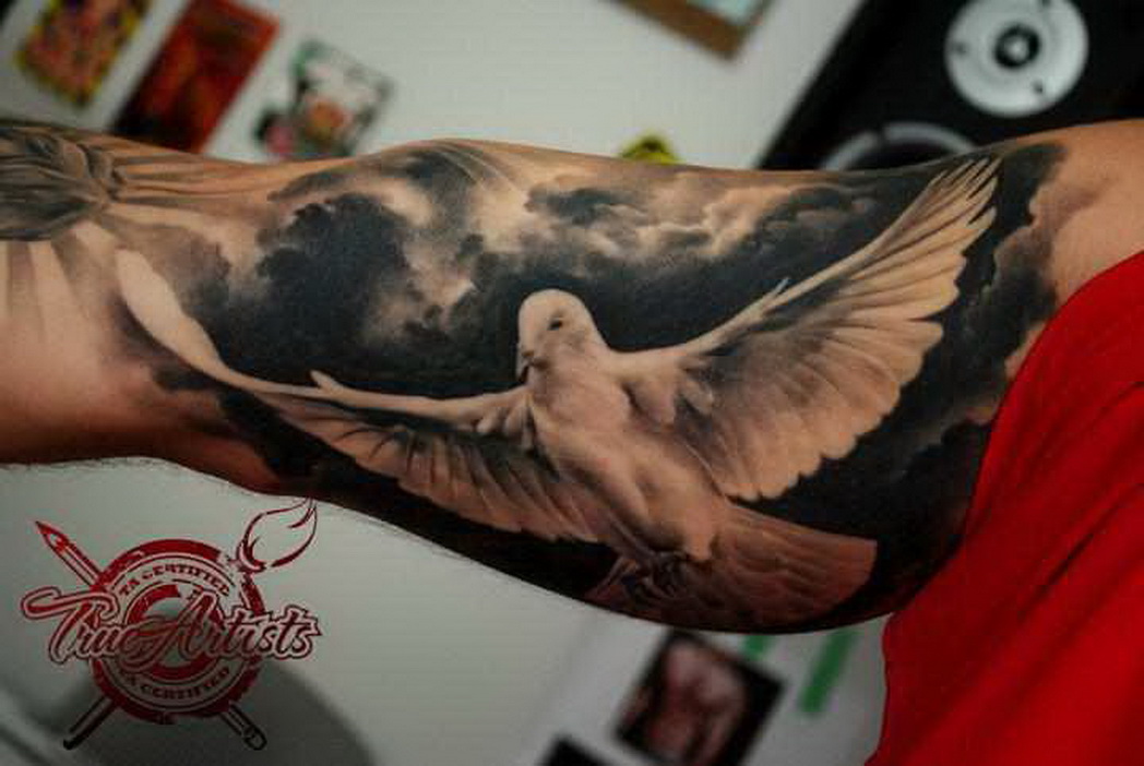 Black And Grey 3D Flying Dove Tattoo On Bicep By Dennis Sivak