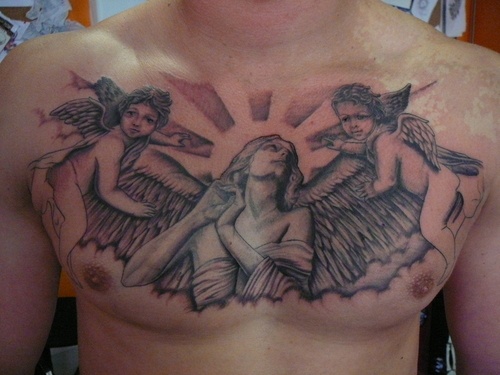 Black And Grey Angel With Cherub Angel Tattoo On Man Chest