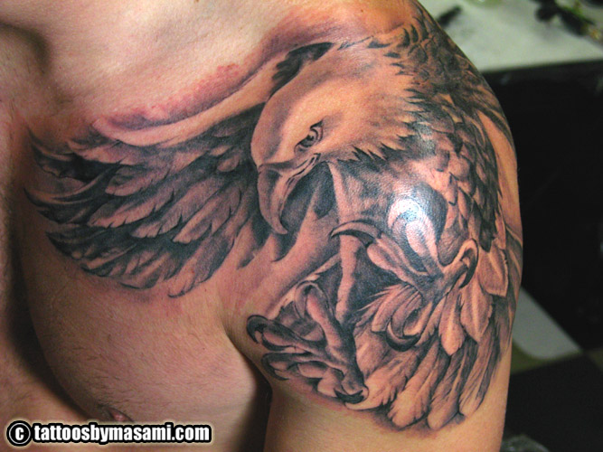 Black And Grey Flying Eagle Tattoo On Man Left Shoulder