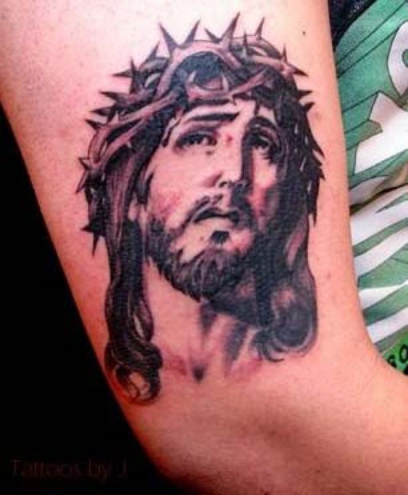 Black And Grey Jesus Face Tattoo On Elbow
