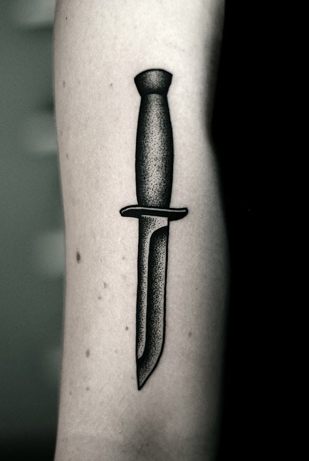 Black And Grey Knife Tattoo On Arm