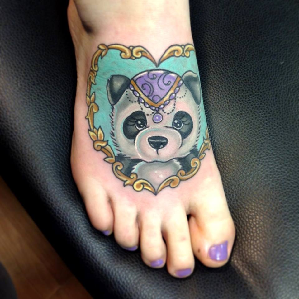 Black And Grey Panda In Heart Frame Tattoo On Foot
