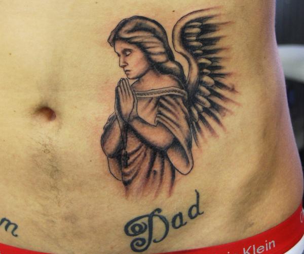 Black And Grey Praying Angel Tattoo On Man Stomach