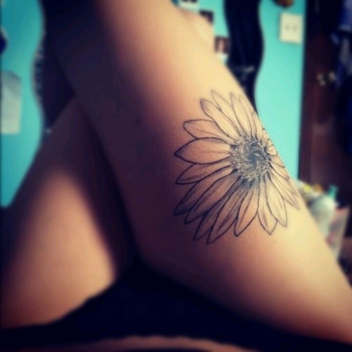 Black And Grey Sunflower Tattoo On Girl Thigh