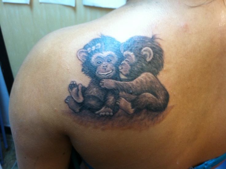 Black And Grey Two Baby Monkeys Tattoo On Left Back Shoulder