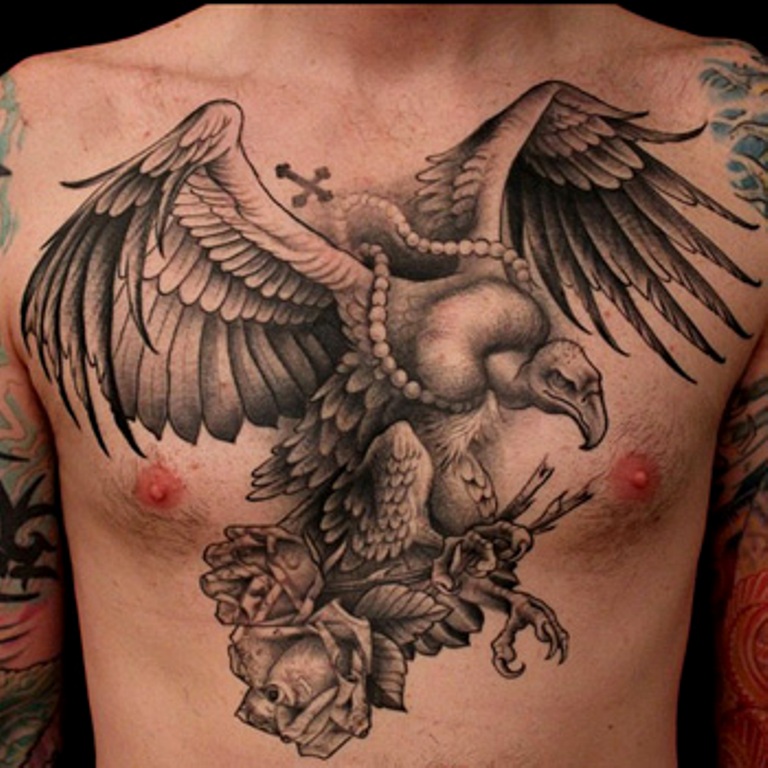 Black And Grey Vulture With Rosary Cross Tattoo On Man Chest
