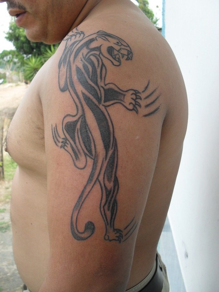 Black Climbing Leopard Tattoo On Man Shoulder