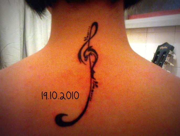 Black Dolphin With Violin Key Tattoo On Back Neck