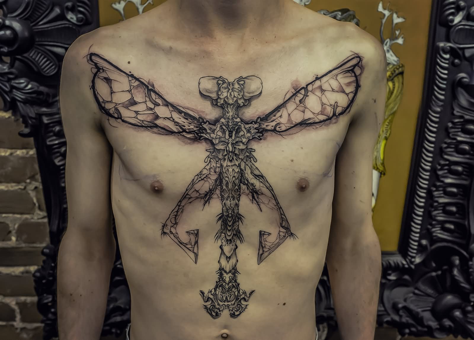 Black Dragonfly Tattoo On man Chest By Remi
