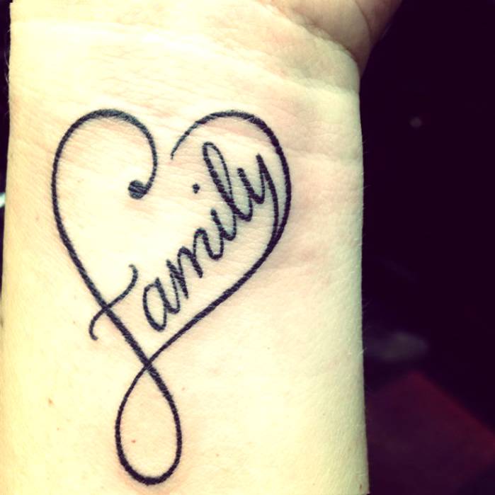 Black Family Word In Infinity Heart Tattoo On Wrist