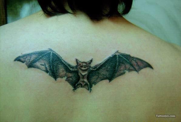 Black Flying Bat Tattoo On Upper Back Shoulder