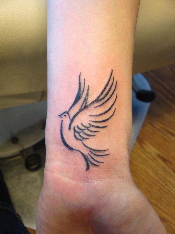 Black Flying Dove Tattoo On Wrist