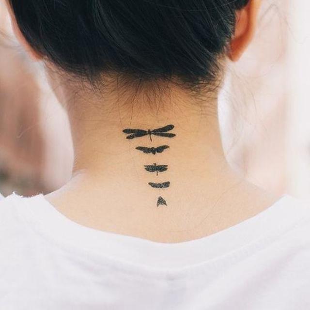 Black Little Dragonflies Tattoo On Girl Back Neck