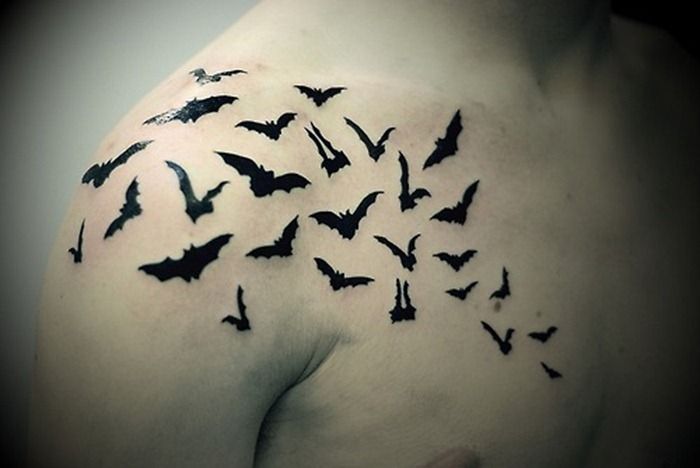 Black Little Flying Bats Tattoo On Front Shoulder