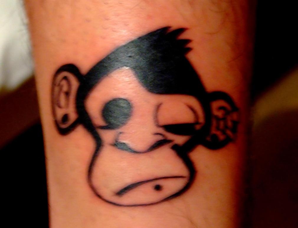 Black Monkey Face Tattoo Design By Daniel