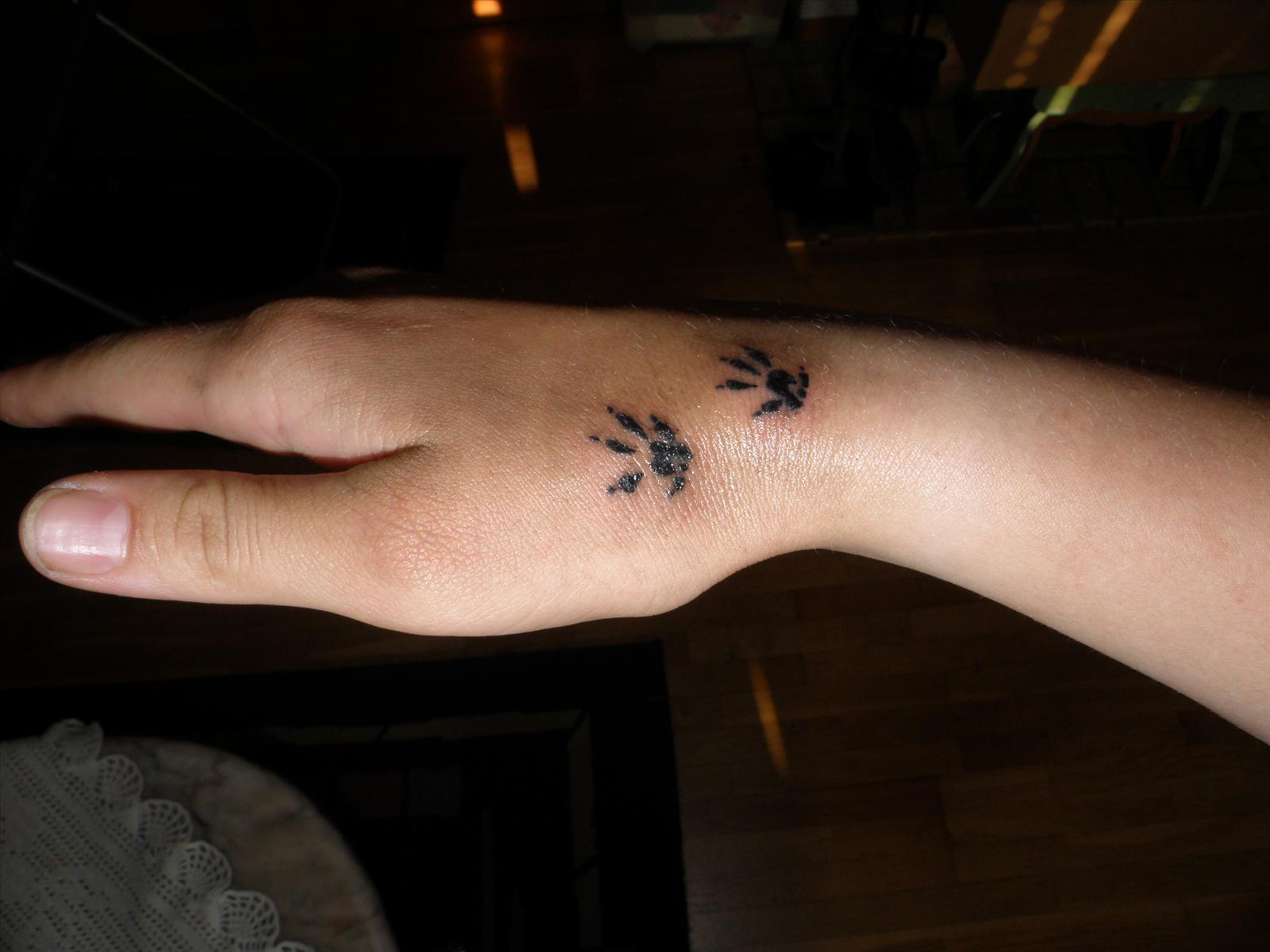 Black Rat Paw Print Tattoo On Hand By Monstrum
