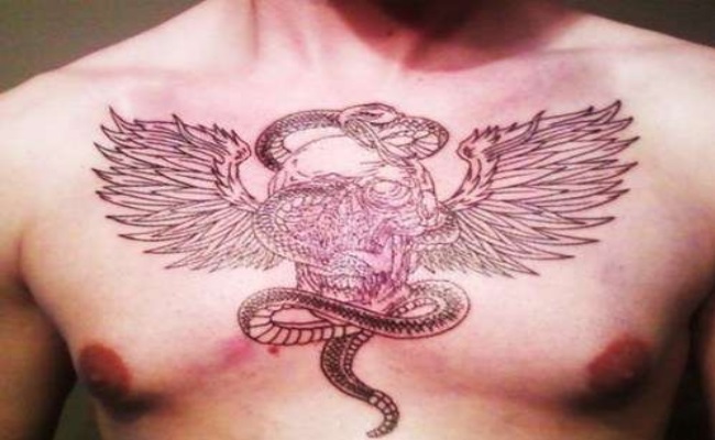 Black Snake With Wings Tattoo On Man Chest By Carl