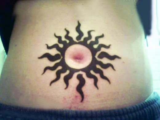 Black Sun Tattoo On Belly Button.