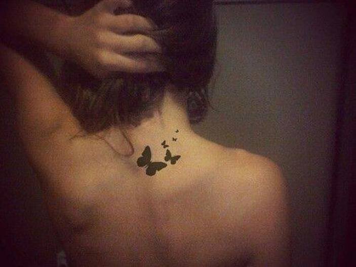 Black Tiny Butterflies Tattoo On Back Neck By Karin