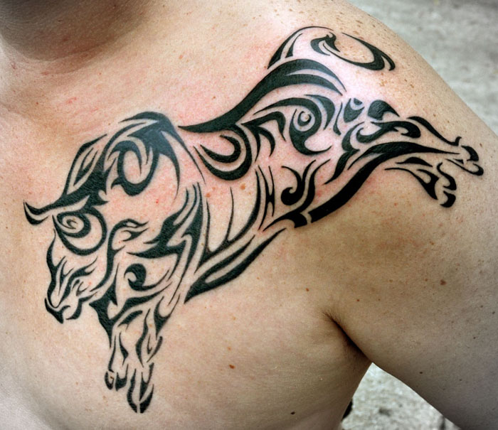 Black Tribal Bull Tattoo On Man Front Shoulder