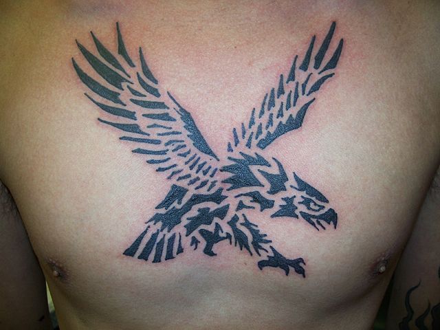 Black Tribal Flying Eagle Tattoo On Man Chest By Keith Killingsworth