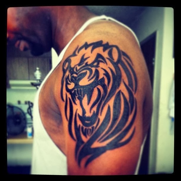Black Tribal Lion Face Animal Tattoo On Shoulder