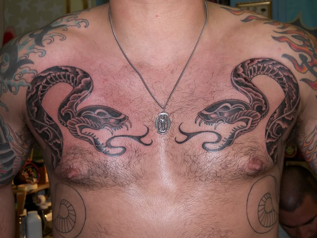 Black Two Snakes Tattoo On Man Chest By Robmerrill