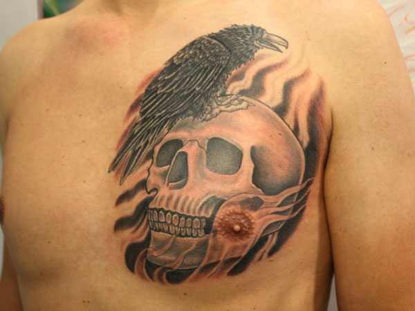 Black Vulture Sit on Skull Tattoo On Man Chest