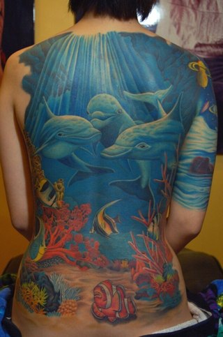 Blue Three Dolphins In Ocean Tattoo On Full Back