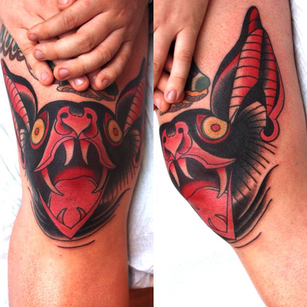 Colorful Bat Face Tattoo On Knees