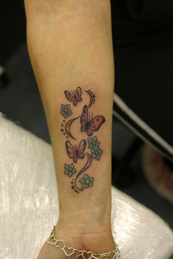 Colorful Butterflies And Flowers Tattoo On Forearm