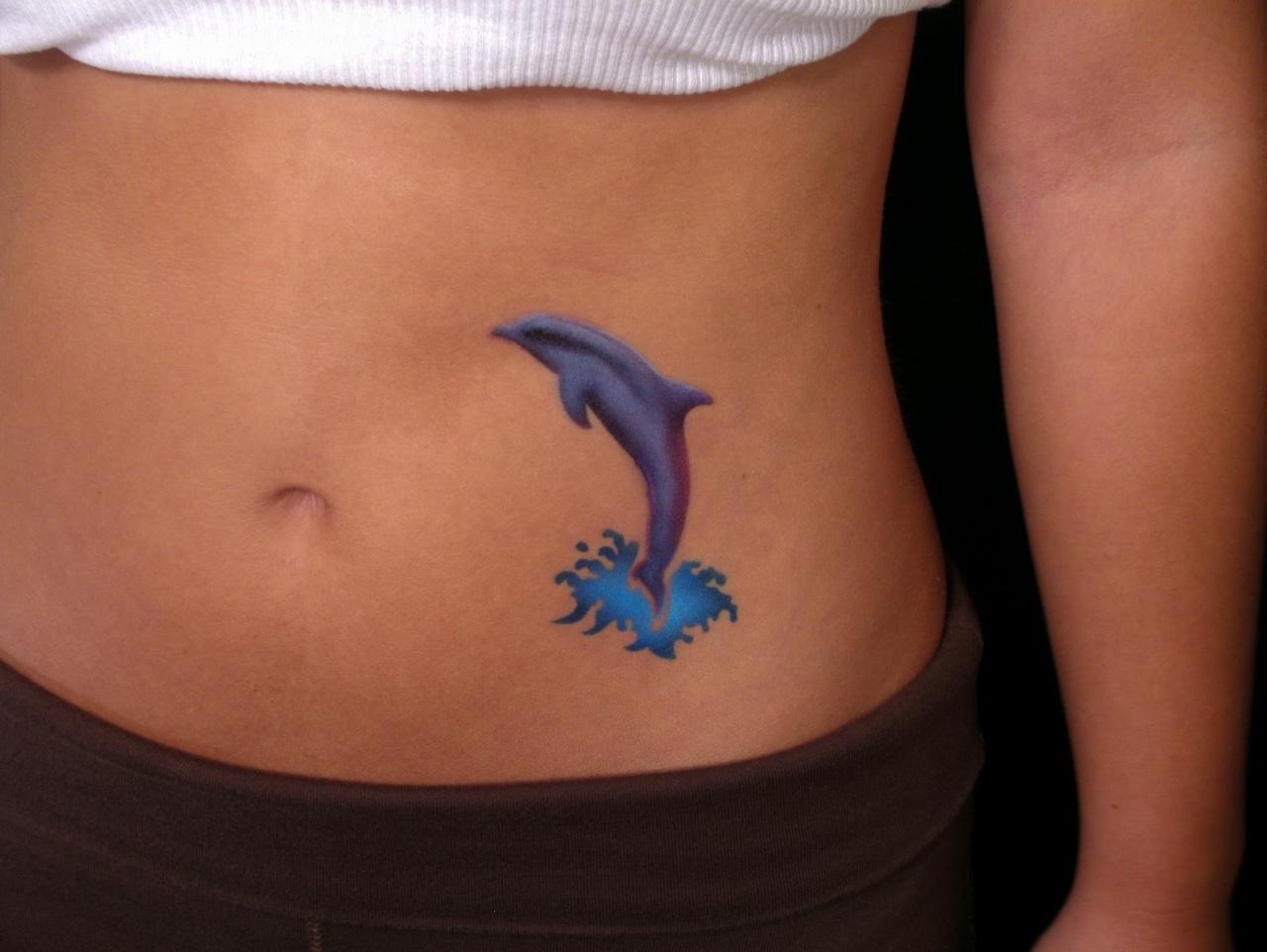Colorful Dolphin Tattoo On Girl Stomach