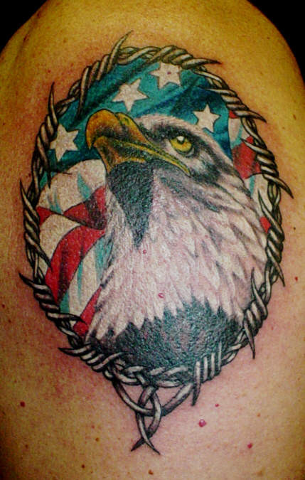 Colorful Eagle With America Flag In Frame Tattoo On Shoulder By Erika Stanley