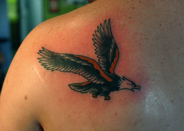 Colorful Flying Eagle Tattoo On Man Left Back Shoulder