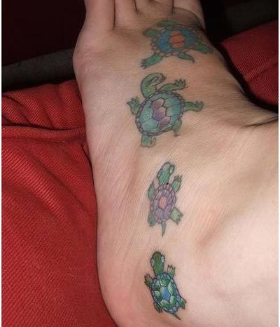 Colorful Little Turtles Tattoo On Foot