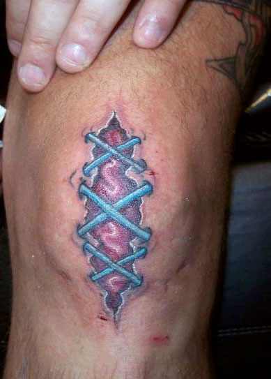 Colorful Stitched Tattoo On knee