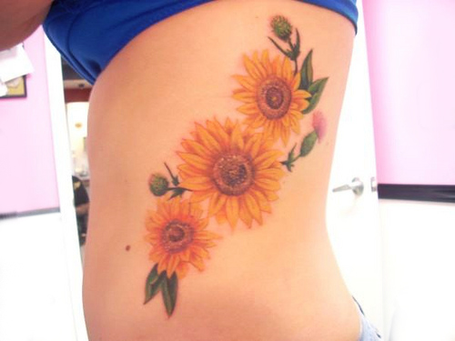 Colorful Three Sunflowers With Leaves Tattoo On Girl Side Rib