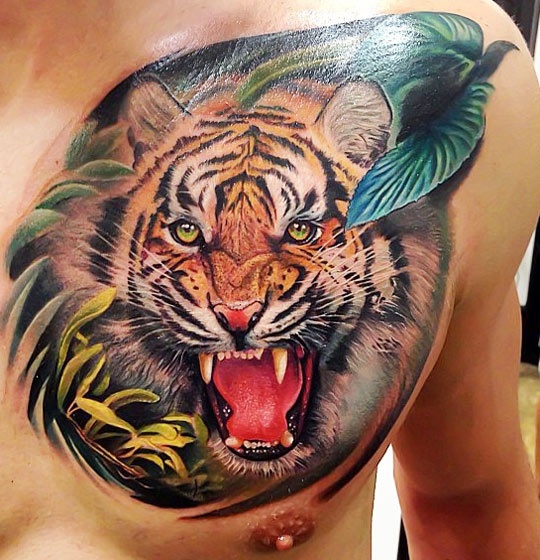 Colorful Tiger Roaring Face Tattoo On Man Chest By Rember Orellana