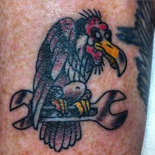 Colorful Vulture Sit On Spanner Tattoo Design