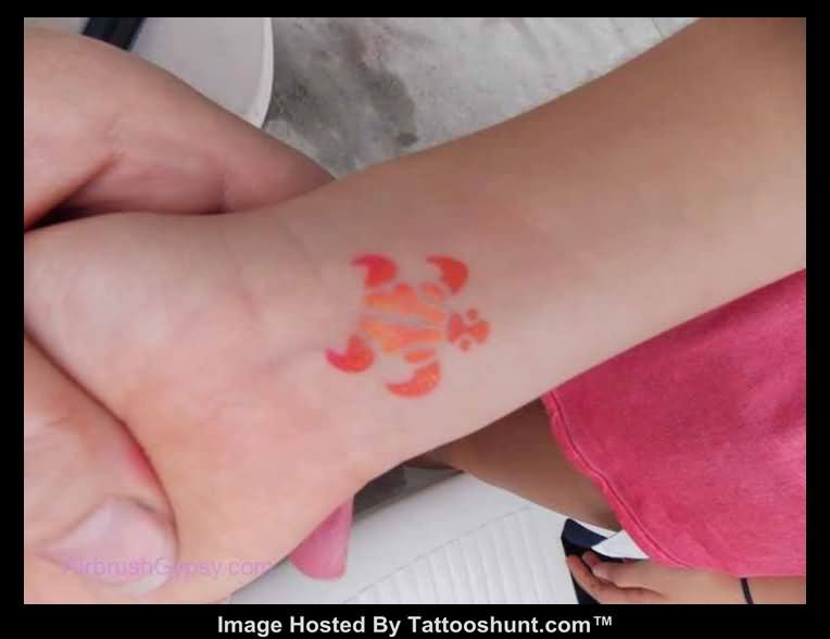 Cute Orange Turtle Tattoo On Wrist